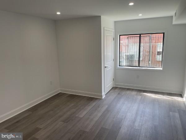 9906 Bustleton Avenue, Unit F3 Philadelphia, PA 19115 - Photo 5 of 8 an empty room with wooden floor and windows