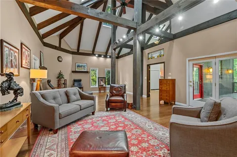 a living room with furniture and a rug