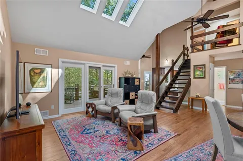 a living room with furniture and a rug