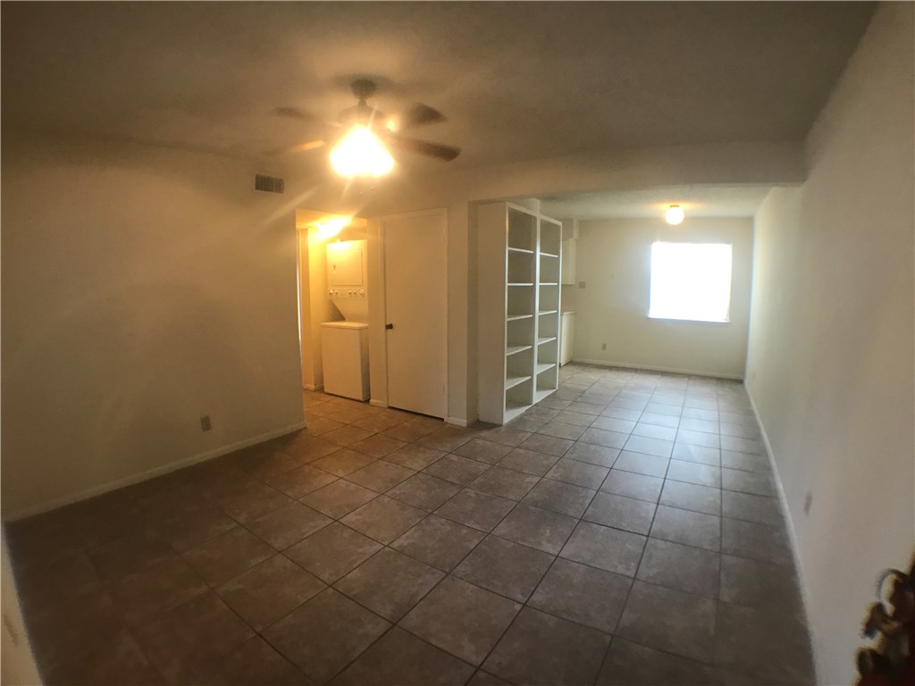 2408 Longview Street, Unit 110 Austin, TX 78705 - Photo 5 of 7 an empty room with a empty space and windows