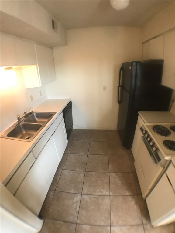 2408 Longview Street, Unit 110 Austin, TX 78705 - Photo 6 of 7 a kitchen with a stove top oven and cabinets