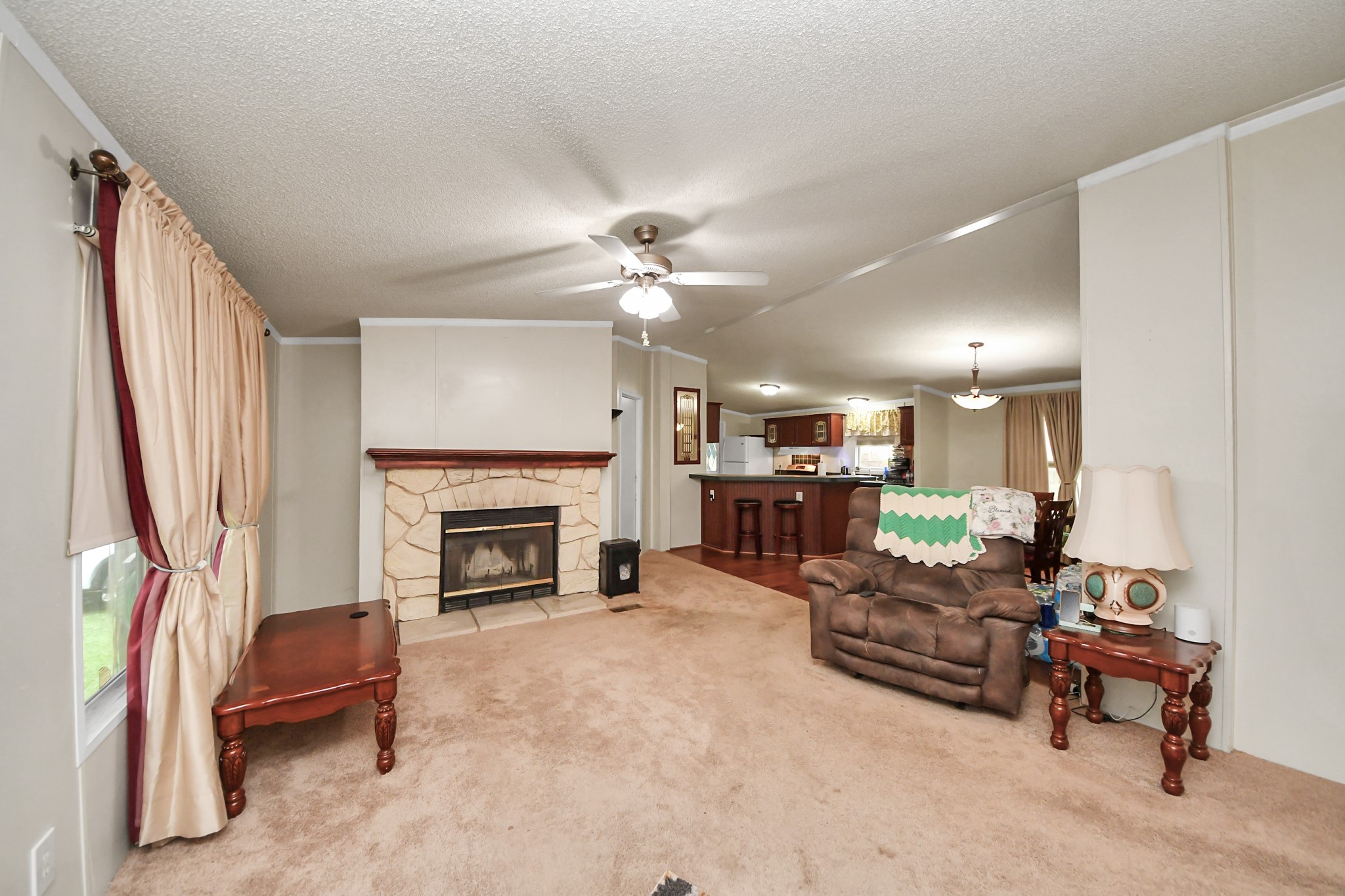 204 Edith Street Highlands, TX 77562 - Photo 6 of 33 a living room with furniture and a fireplace