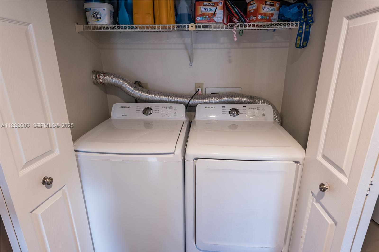 8810 Southwest 132nd Place, Unit 404DN Miami, FL 33186 - Photo 14 of 20 a utility room with dryer and washer
