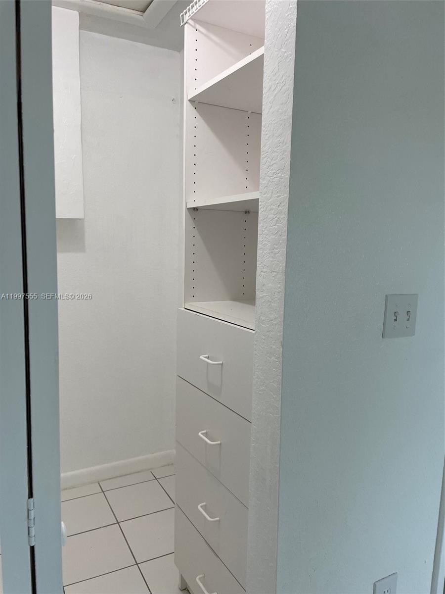 9771 Southwest 211 Street Cutler Bay, FL 33189 - Photo 16 of 19 an empty room with closet