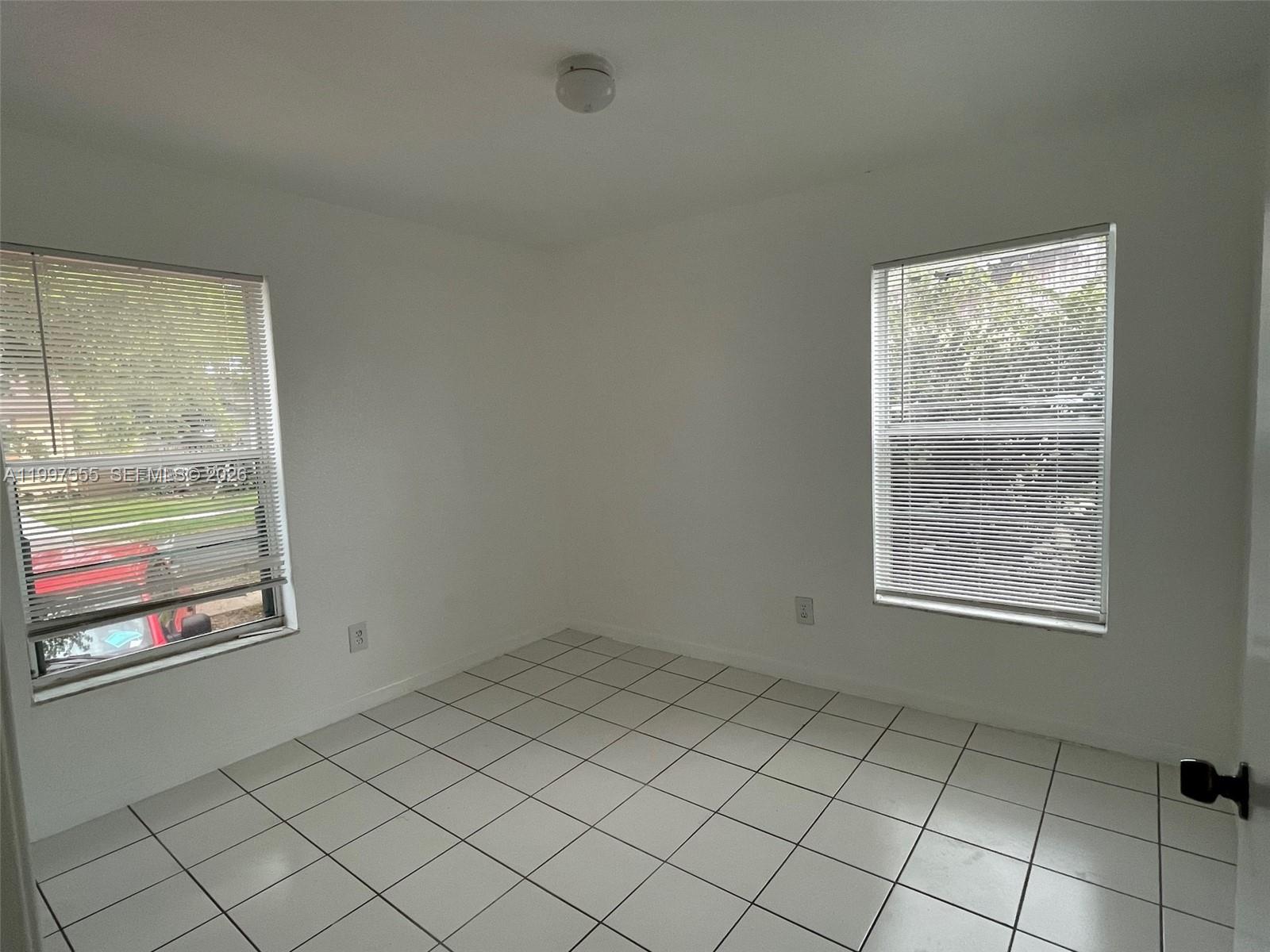 9771 Southwest 211 Street Cutler Bay, FL 33189 - Photo 19 of 19 an empty room with windows