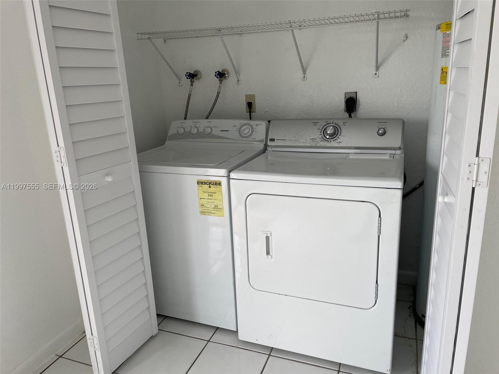 9771 Southwest 211 Street Cutler Bay, FL 33189 - Photo 8 of 19 a utility room with dryer and washer