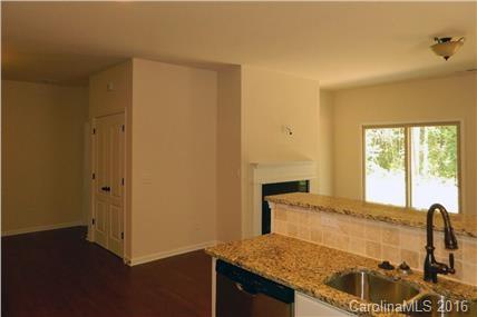 1532 Spring Blossom Trail, Unit SITE 41 Fort Mill, SC 29708 - Photo 15 of 20 a bathroom with a granite countertop sink and a bathtub