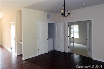 1532 Spring Blossom Trail, Unit SITE 41 Fort Mill, SC 29708 - Photo 17 of 20 a view of a hallway with wooden floor and closet area