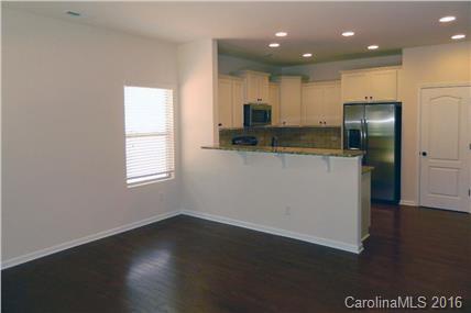 1532 Spring Blossom Trail, Unit SITE 41 Fort Mill, SC 29708 - Photo 18 of 20 a kitchen with stainless steel appliances a refrigerator and a stove