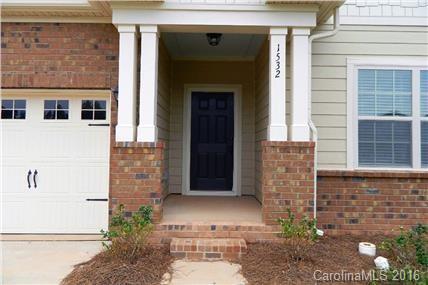 1532 Spring Blossom Trail, Unit SITE 41 Fort Mill, SC 29708 - Photo 3 of 20 a front view of a house with garden