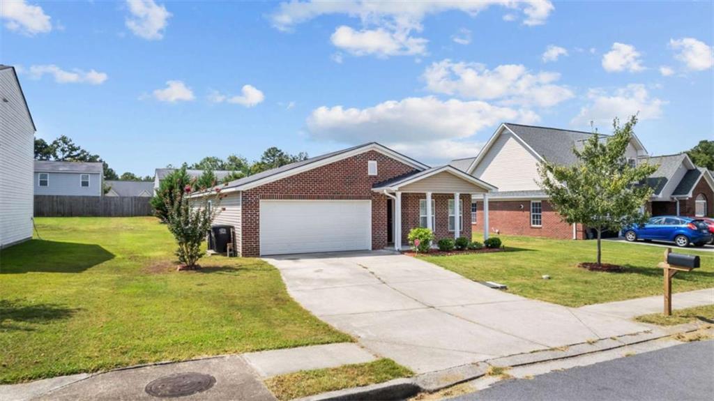 31 Southfork Drive Rome, GA 30165 - Photo 2 of 24 a front view of a house with garden