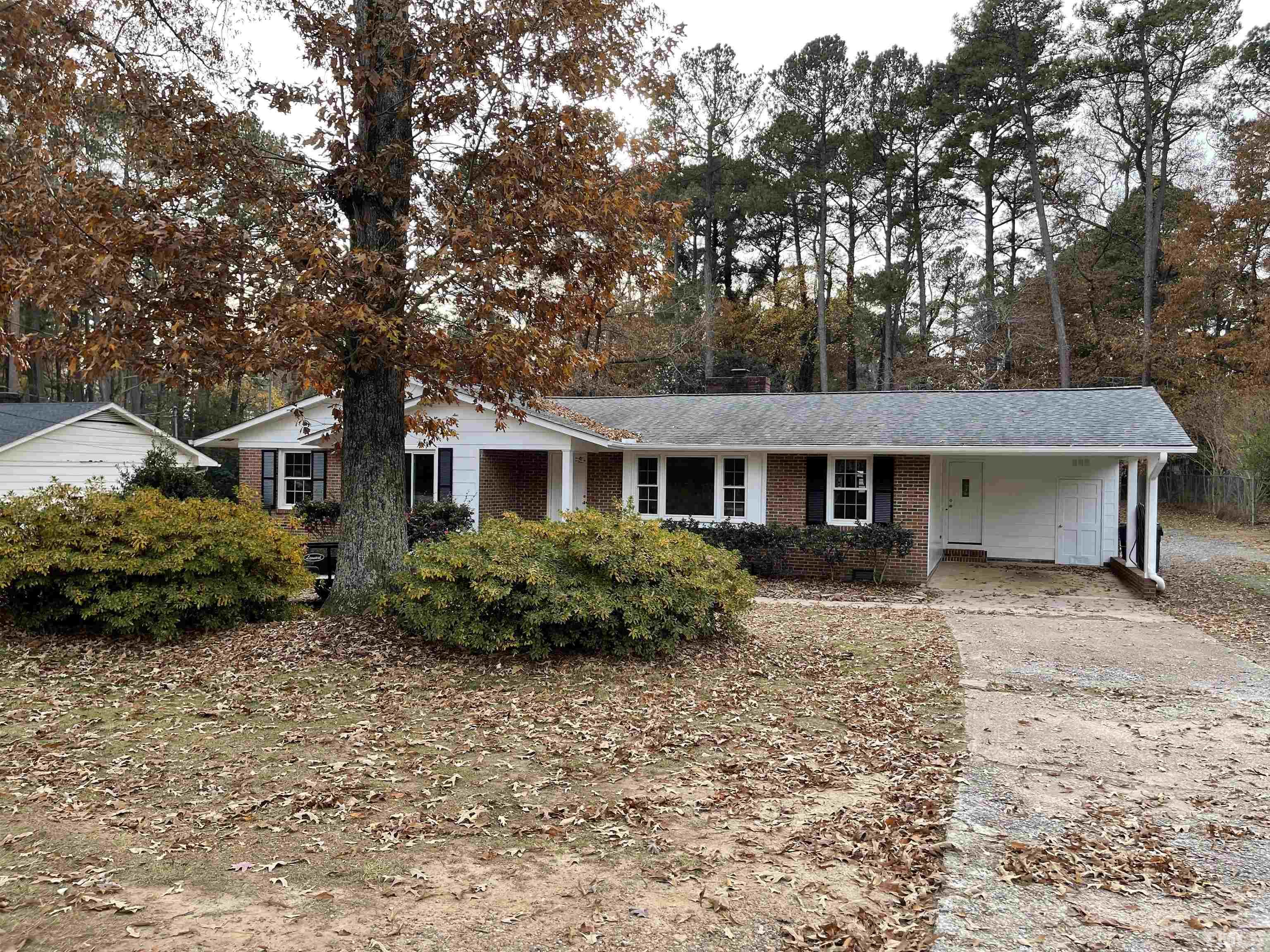 7701 Leesville Road Raleigh, NC 27613 - Photo 1 of 33 front view of a house with a yard