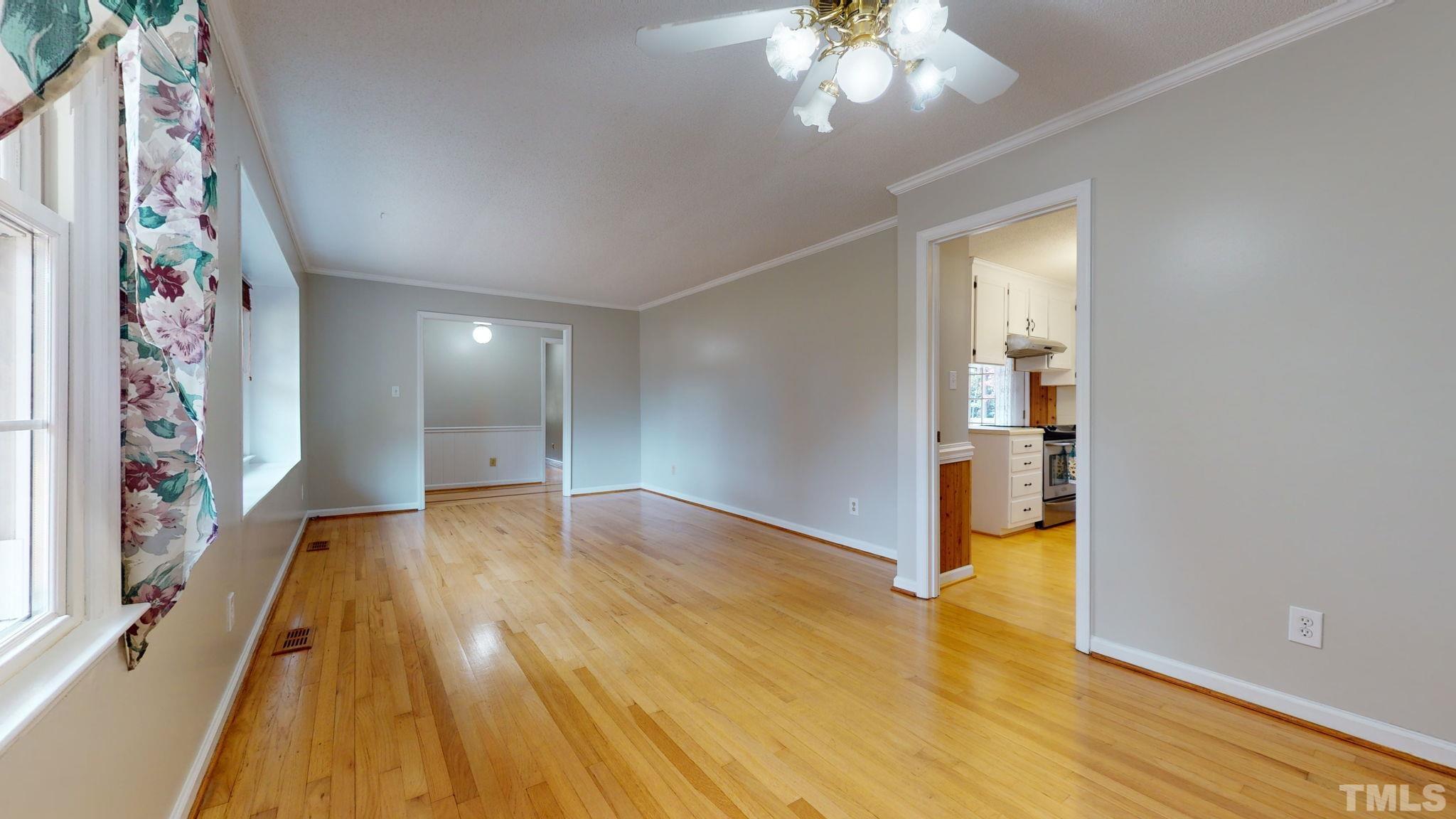 7701 Leesville Road Raleigh, NC 27613 - Photo 17 of 33 a view of a hallway with wooden floor