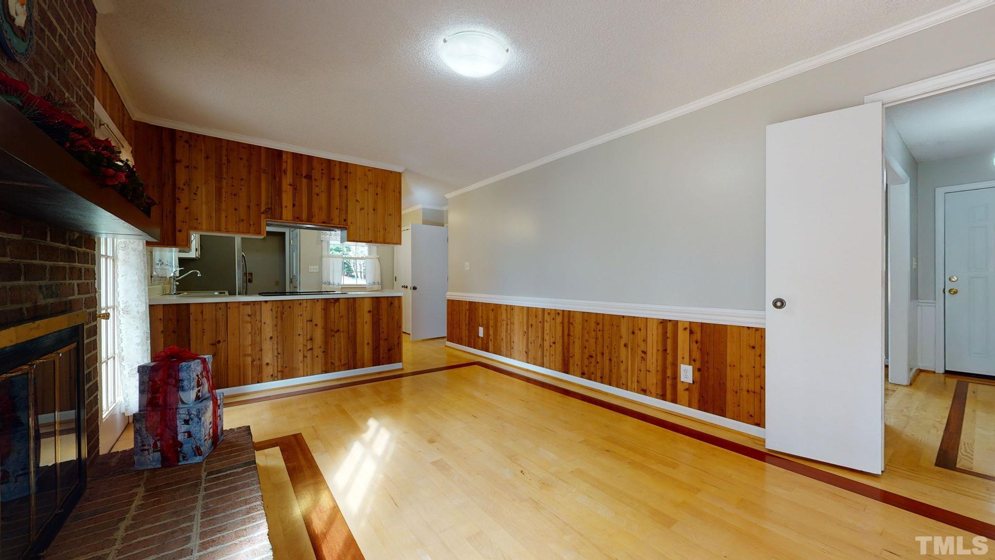 7701 Leesville Road Raleigh, NC 27613 - Photo 24 of 33 a view of an empty room with wooden floor