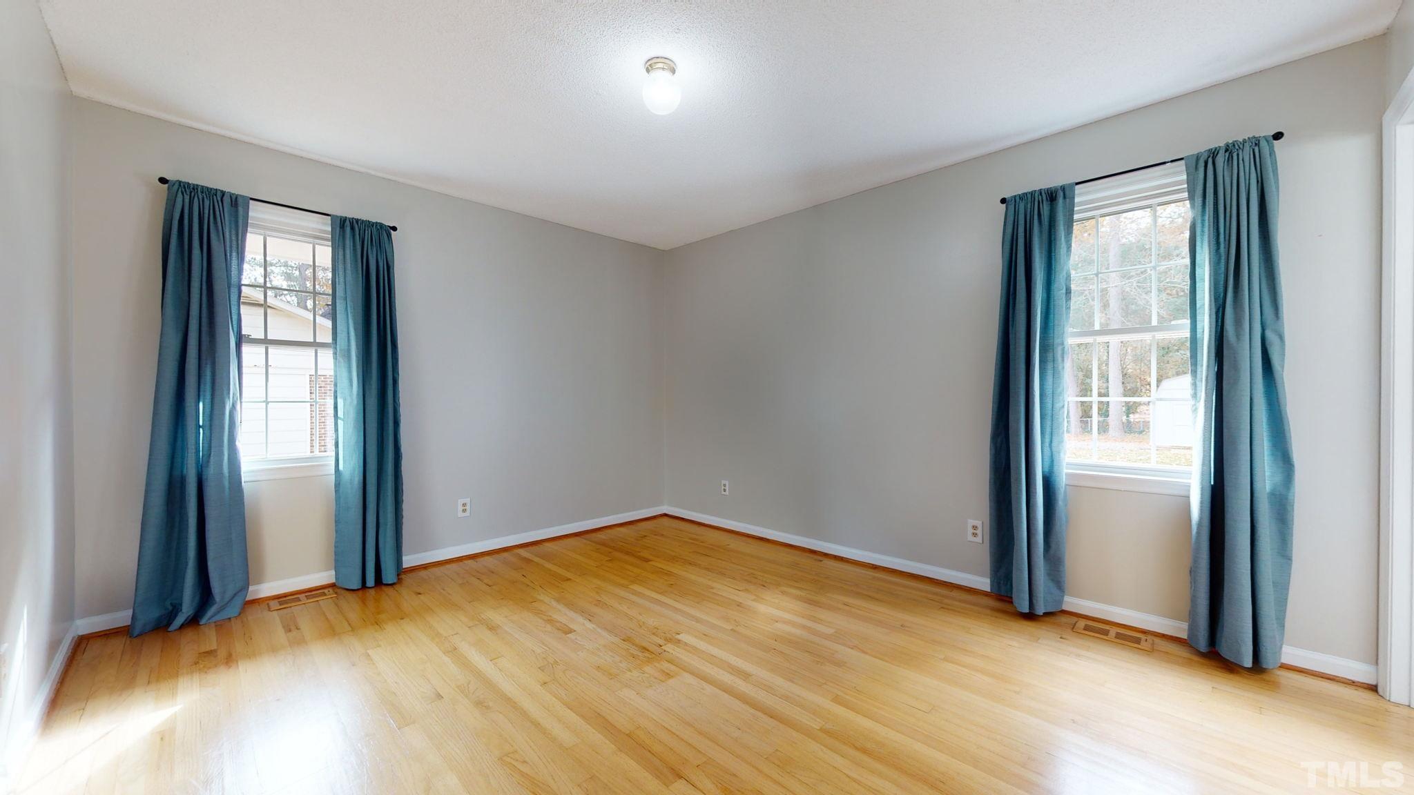7701 Leesville Road Raleigh, NC 27613 - Photo 25 of 33 an empty room with windows