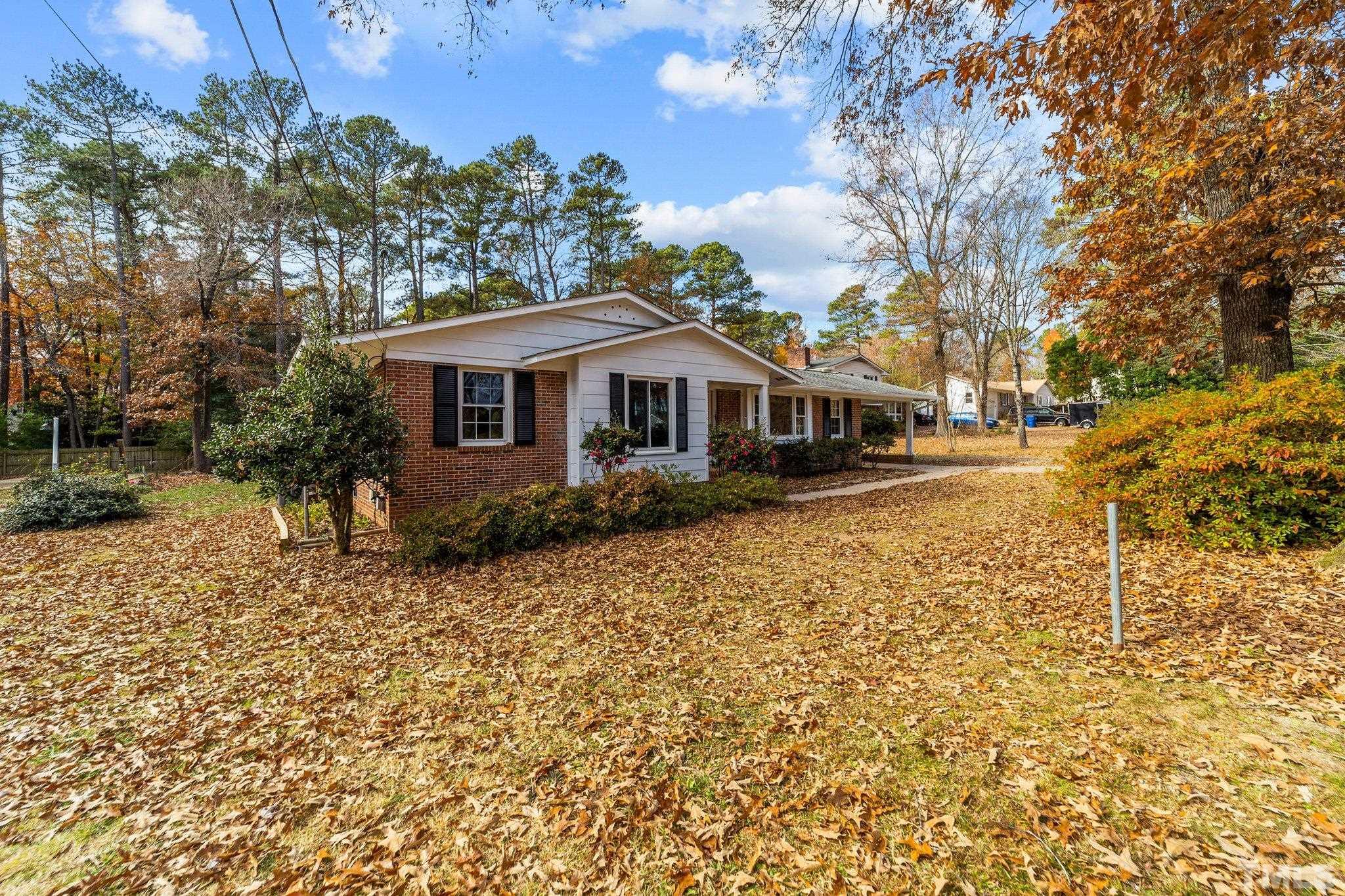 7701 Leesville Road Raleigh, NC 27613 - Photo 5 of 33 front view of a house with a yard