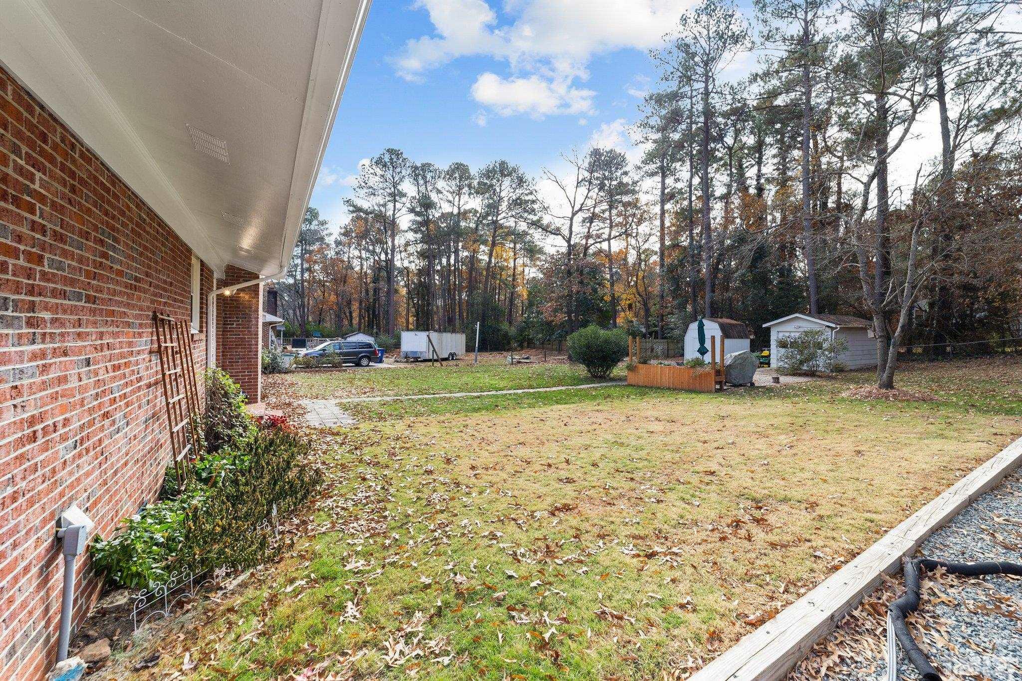 7701 Leesville Road Raleigh, NC 27613 - Photo 8 of 33 a view of a backyard with sitting area