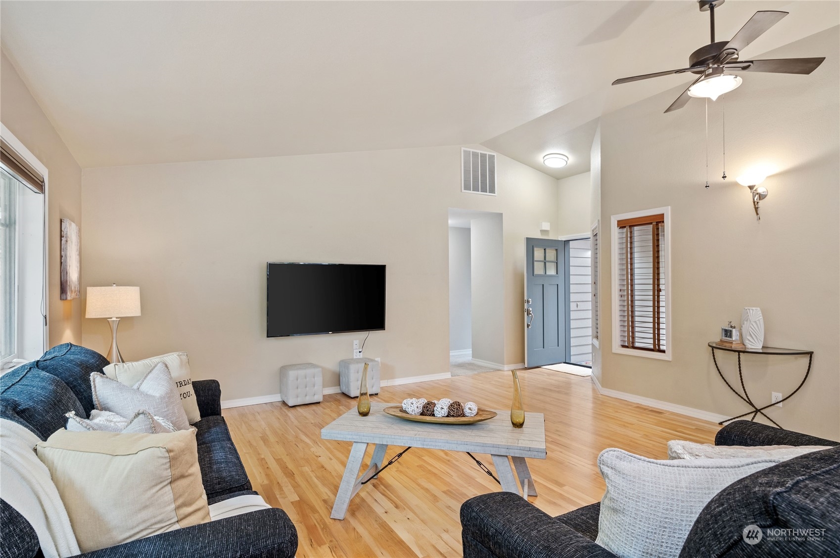 3860 Northeast Iverson Road Poulsbo, WA 98370 - Photo 13 of 40 a living room with furniture and a flat screen tv