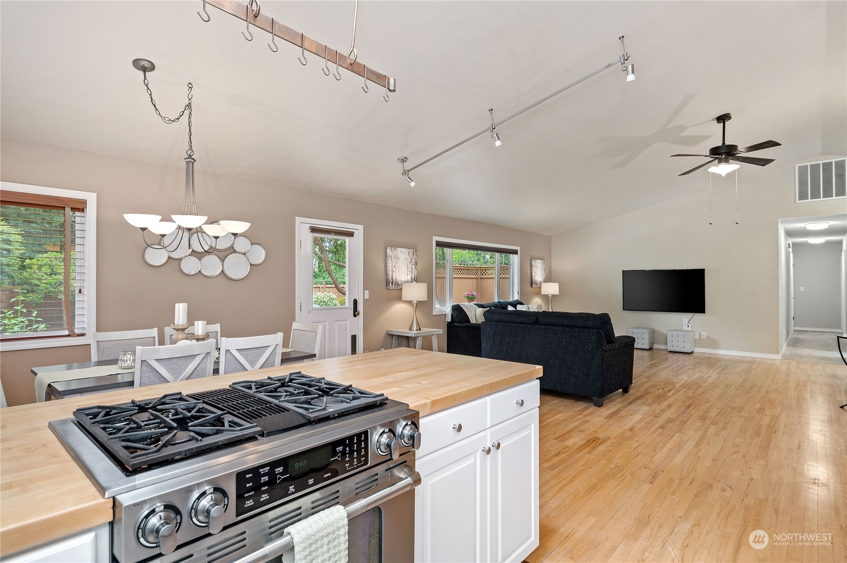 3860 Northeast Iverson Road Poulsbo, WA 98370 - Photo 17 of 40 a kitchen that has a stove and a wooden floor