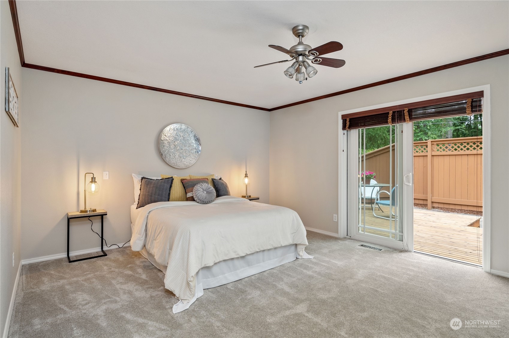 3860 Northeast Iverson Road Poulsbo, WA 98370 - Photo 21 of 40 a bedroom with a bed and a chandelier