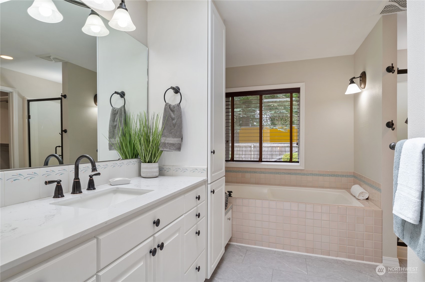 3860 Northeast Iverson Road Poulsbo, WA 98370 - Photo 23 of 40 a bathroom with a double vanity sink mirror and shower