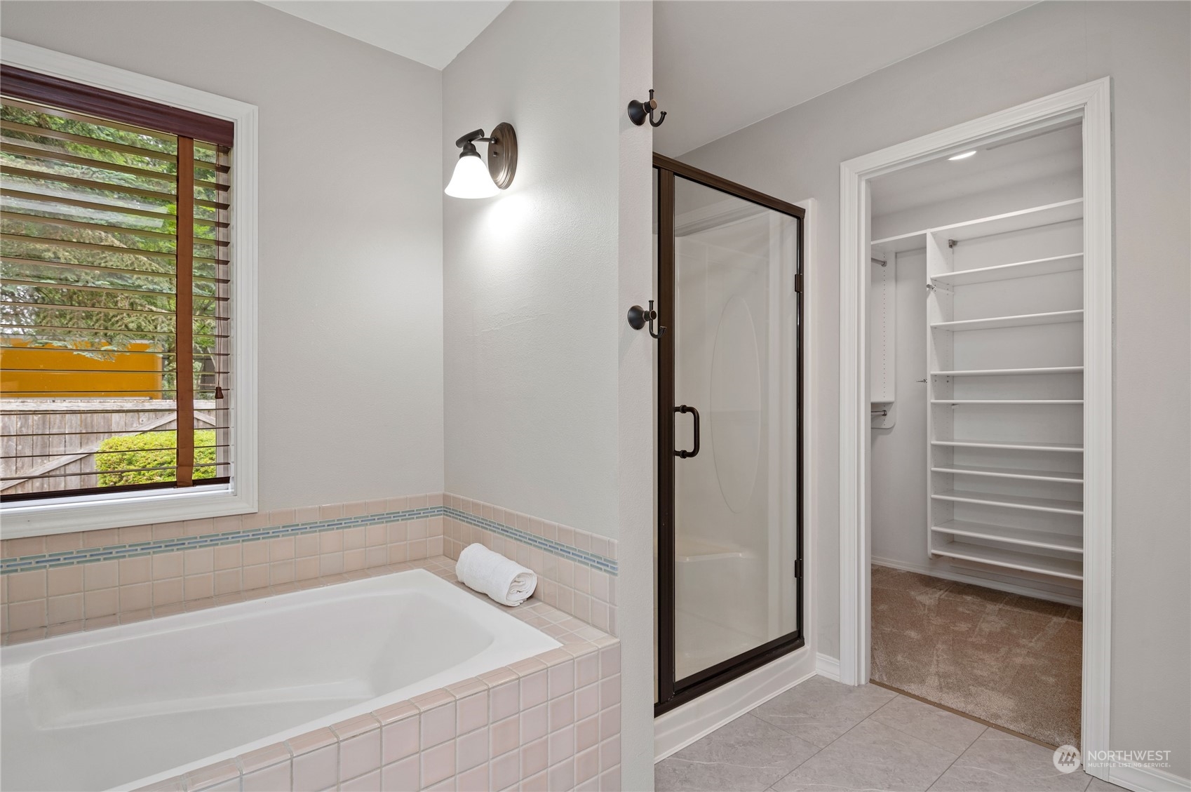 3860 Northeast Iverson Road Poulsbo, WA 98370 - Photo 24 of 40 a bathroom with a bathtub and a shower