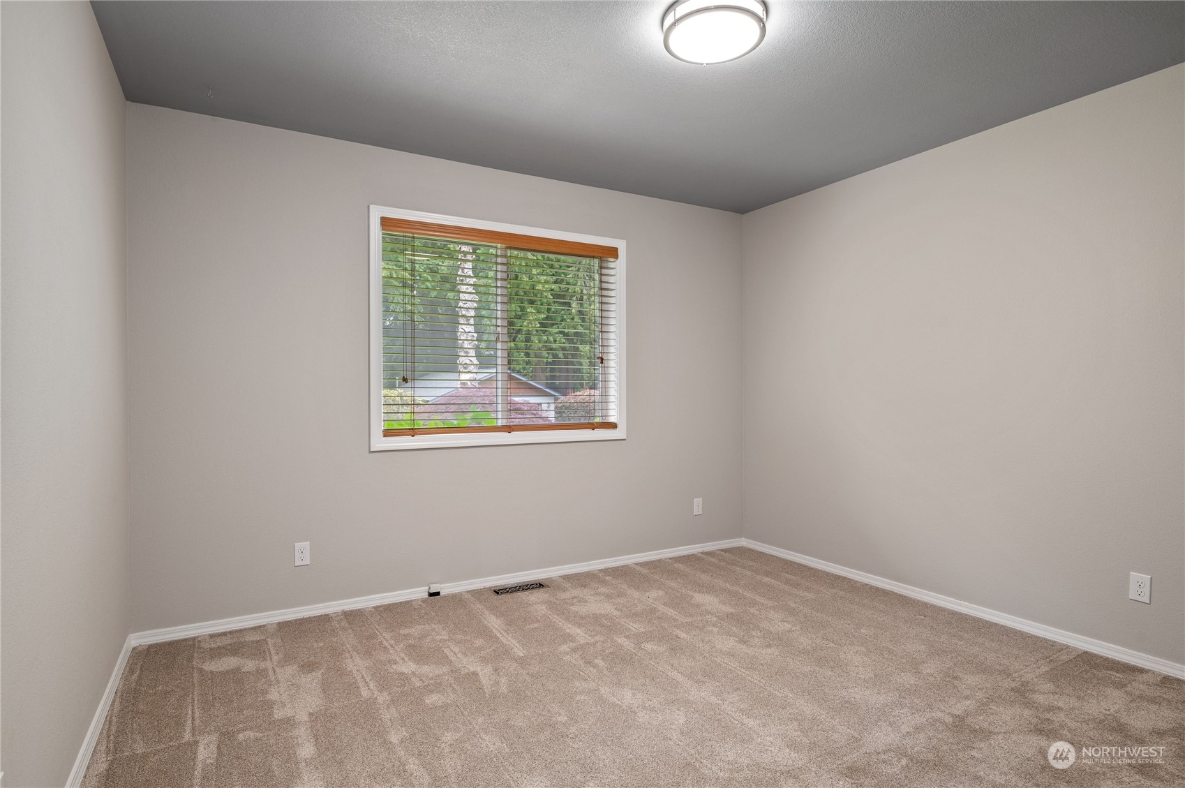 3860 Northeast Iverson Road Poulsbo, WA 98370 - Photo 25 of 40 an empty room with a window