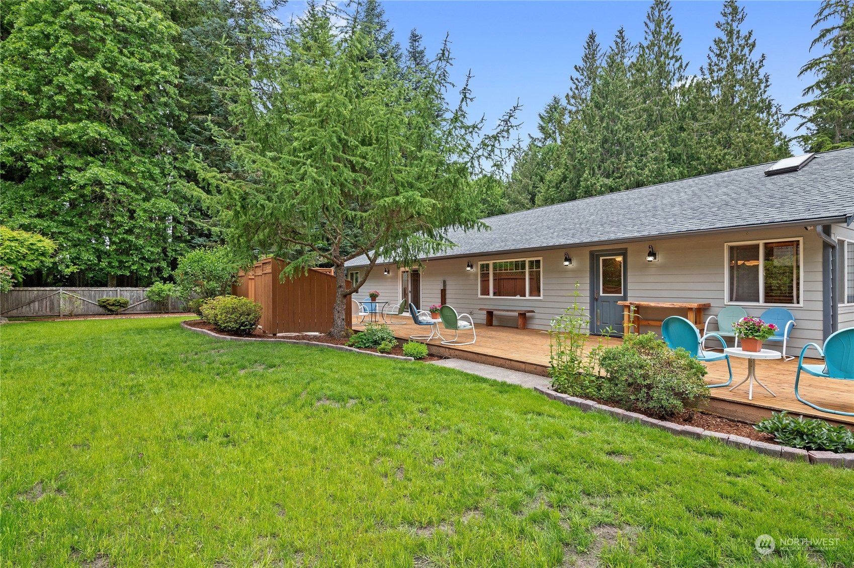 3860 Northeast Iverson Road Poulsbo, WA 98370 - Photo 30 of 40 a front view of house with a garden and patio