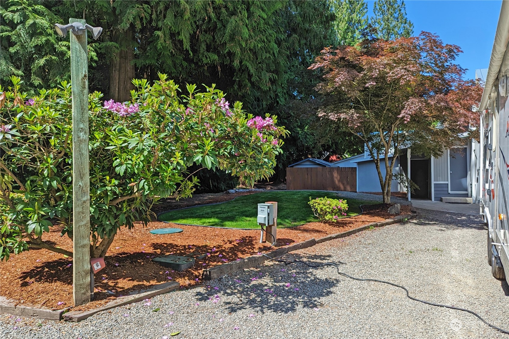 3860 Northeast Iverson Road Poulsbo, WA 98370 - Photo 36 of 40 a backyard of a house with lots of green space