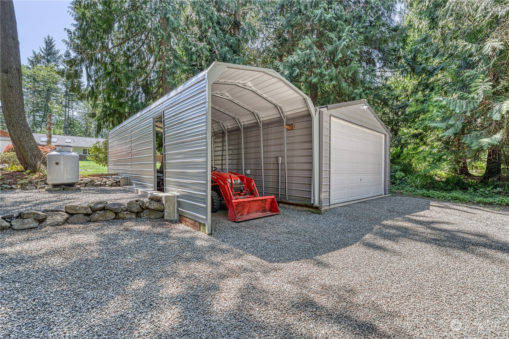 3860 Northeast Iverson Road Poulsbo, WA 98370 - Photo 7 of 40 a view of a house with a backyard