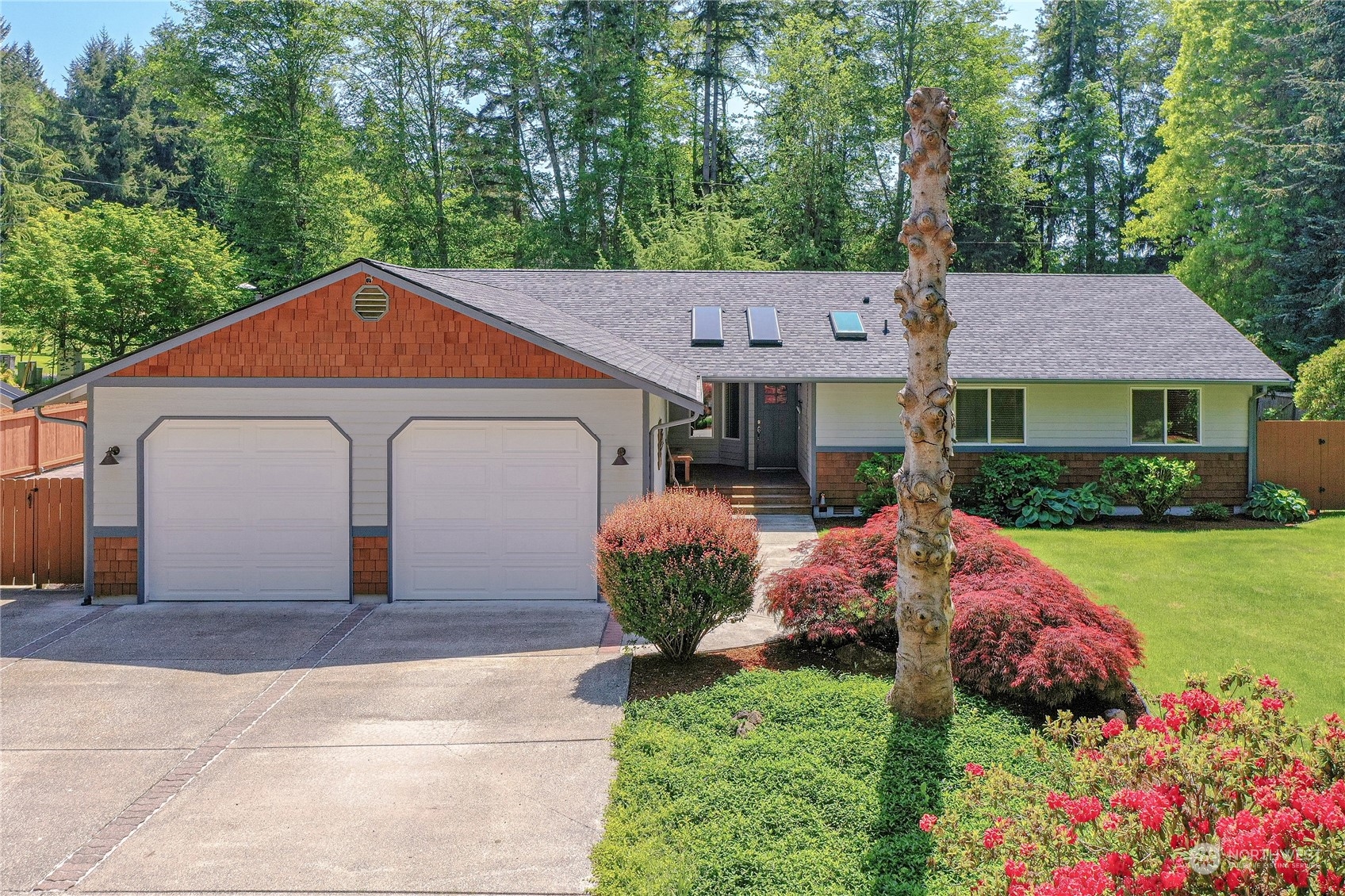 3860 Northeast Iverson Road Poulsbo, WA 98370 - Photo 8 of 40 a front view of a house with garden