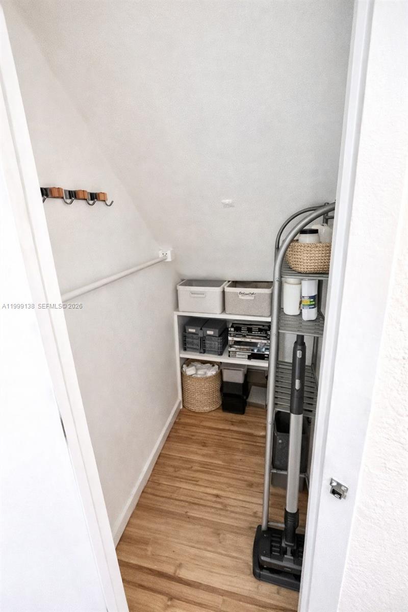 3915 Meridian Avenue, Unit 101 Miami Beach, FL 33140 - Photo 11 of 19 a view of a kitchen from a hallway