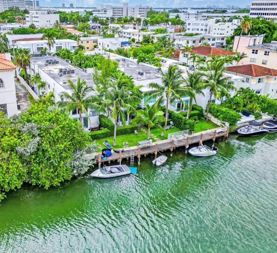 3915 Meridian Avenue, Unit 101 Miami Beach, FL 33140 - Photo 14 of 19 an aerial view of a house with a garden and lake view