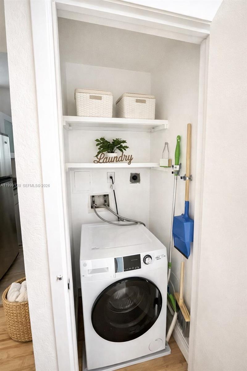 3915 Meridian Avenue, Unit 101 Miami Beach, FL 33140 - Photo 10 of 19 a utility room with dryer and washer