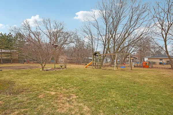 a house that has a tree in front of it