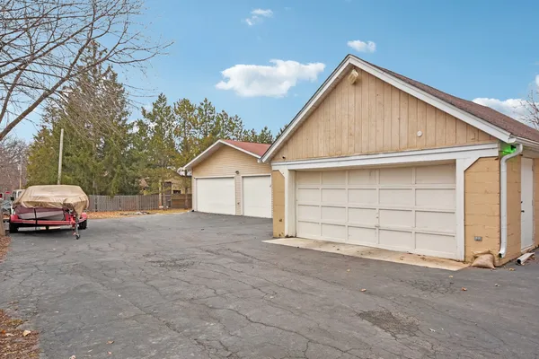 a view of a house with a yard and garage