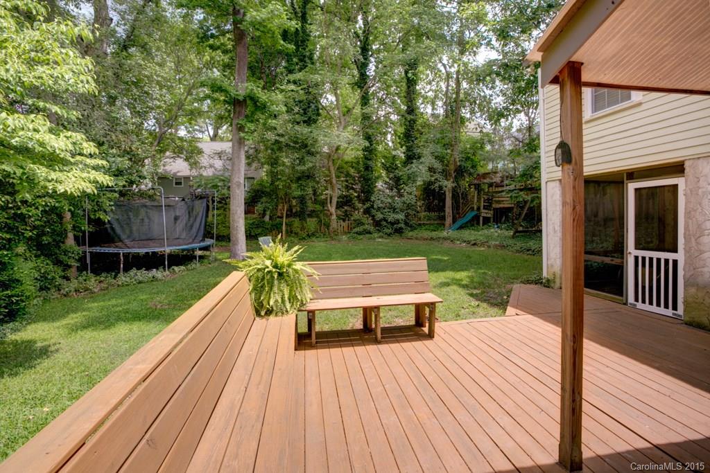 708 Ellsworth Road Charlotte, NC 28211 - Photo 22 of 24 a view of backyard with table and chairs potted plants with wooden floor and fence