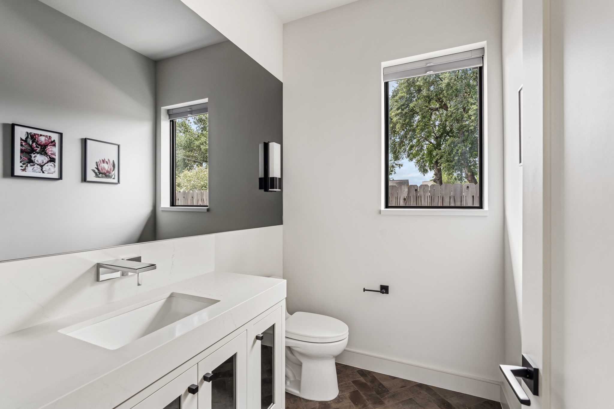 4638 Merwin Street Houston, TX 77027 - Photo 14 of 42 Conveniently located on the first floor, the powder bath has waterfall faucets and is thoughtfully designed for guests and offers quick access to the backyard, ideal for a future pool bath.