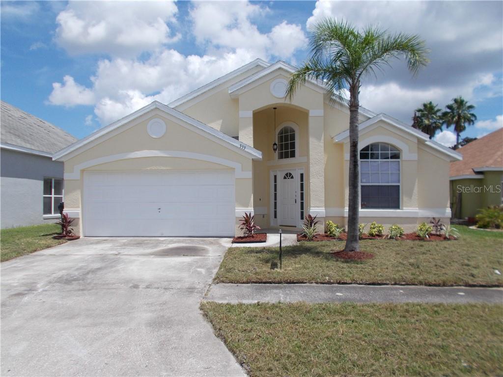 533 Rochester Loop Davenport, FL 33897 - Photo 1 of 1 a view of a house with a yard and garage