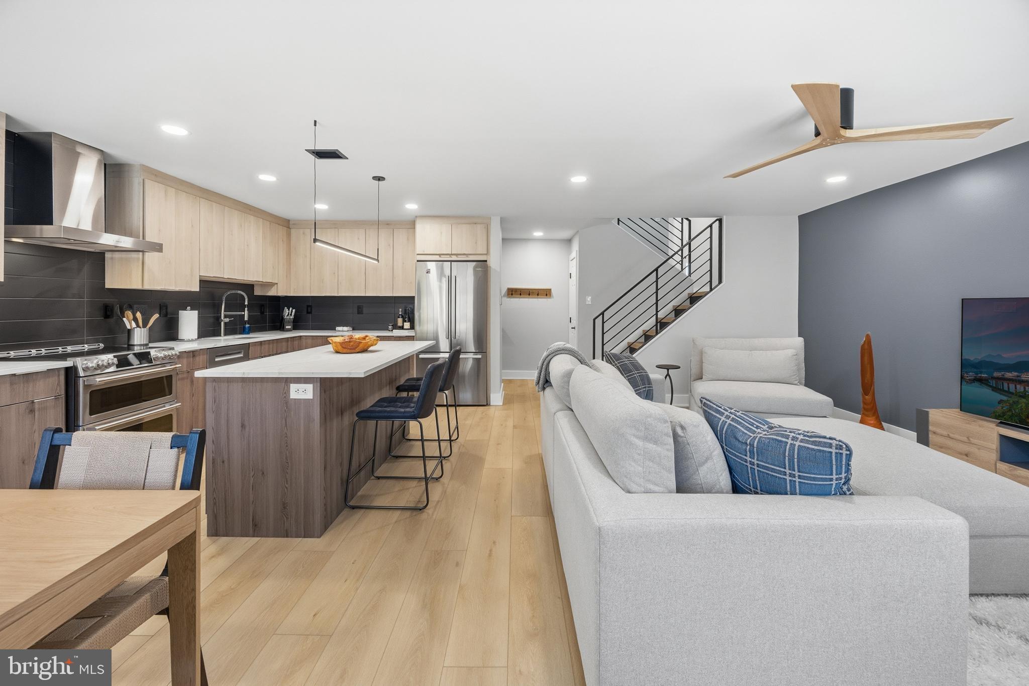 15 Haddonfield Cmns, Unit 15 Haddonfield, NJ 08033 - Photo 2 of 48 a living room with stainless steel appliances furniture and a kitchen view