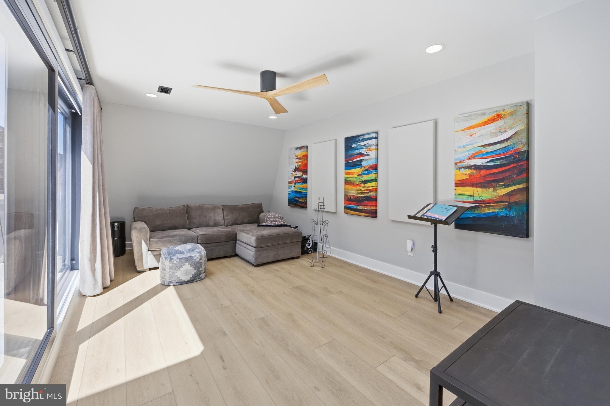 15 Haddonfield Cmns, Unit 15 Haddonfield, NJ 08033 - Photo 32 of 48 a living room with furniture and a flat screen tv