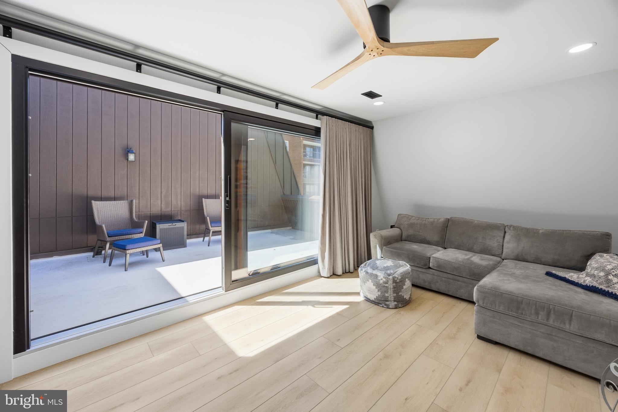 15 Haddonfield Cmns, Unit 15 Haddonfield, NJ 08033 - Photo 34 of 48 a living room with furniture and a rug