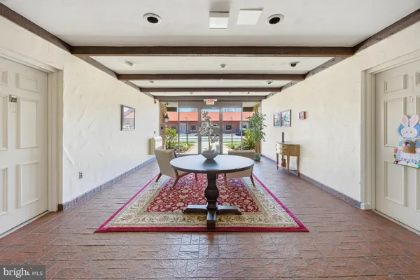 a living room with a rug
