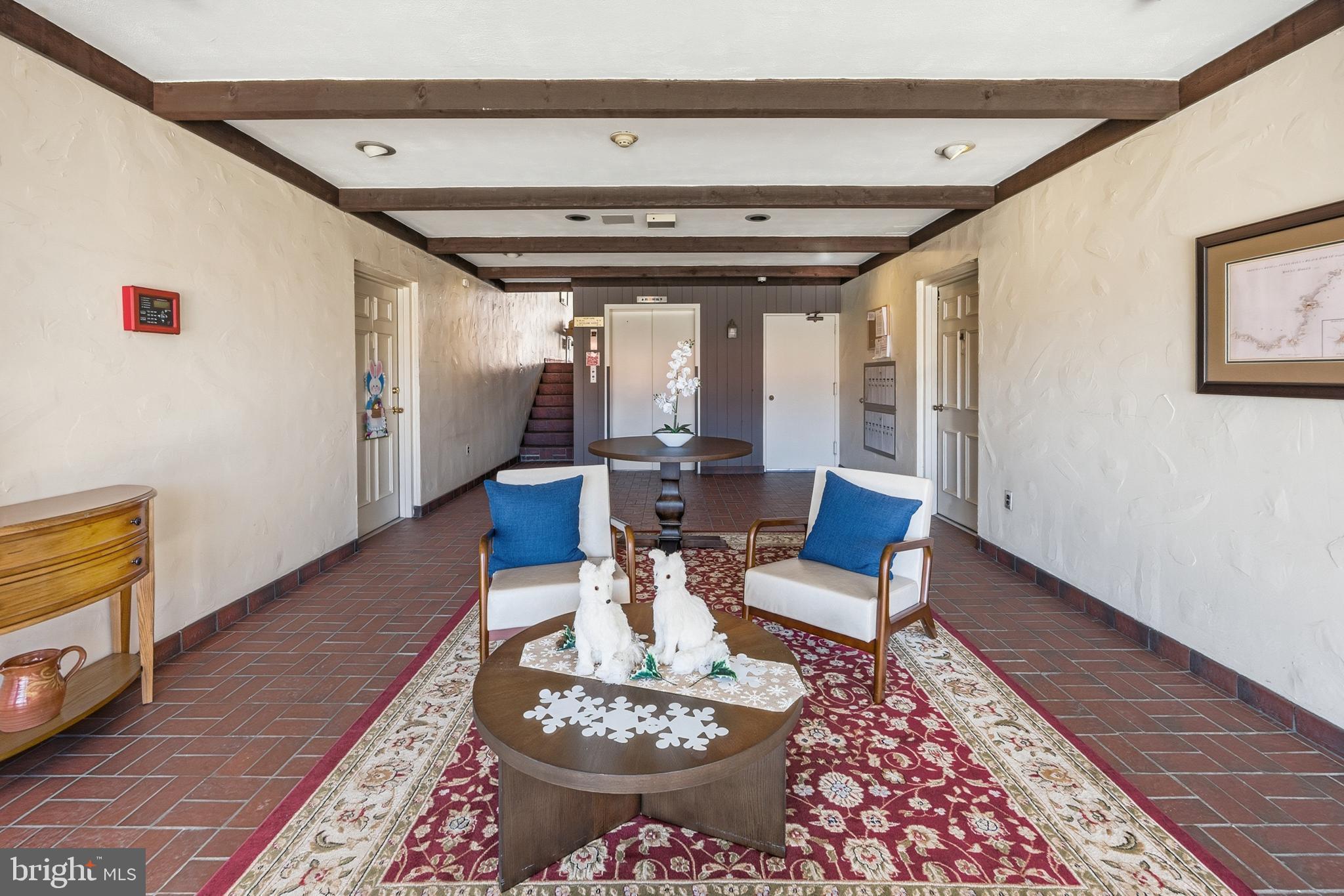 15 Haddonfield Cmns, Unit 15 Haddonfield, NJ 08033 - Photo 40 of 48 a living room with furniture and a wooden floor