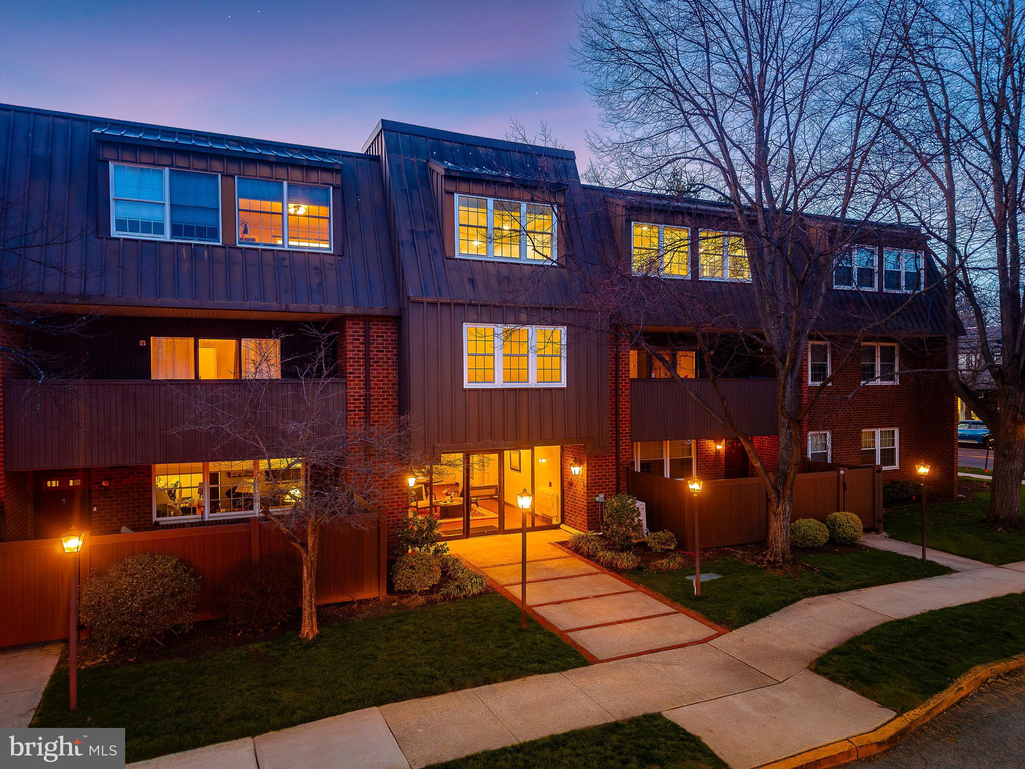 15 Haddonfield Cmns, Unit 15 Haddonfield, NJ 08033 - Photo 42 of 48 a front view of multi story residential apartment building with a yard