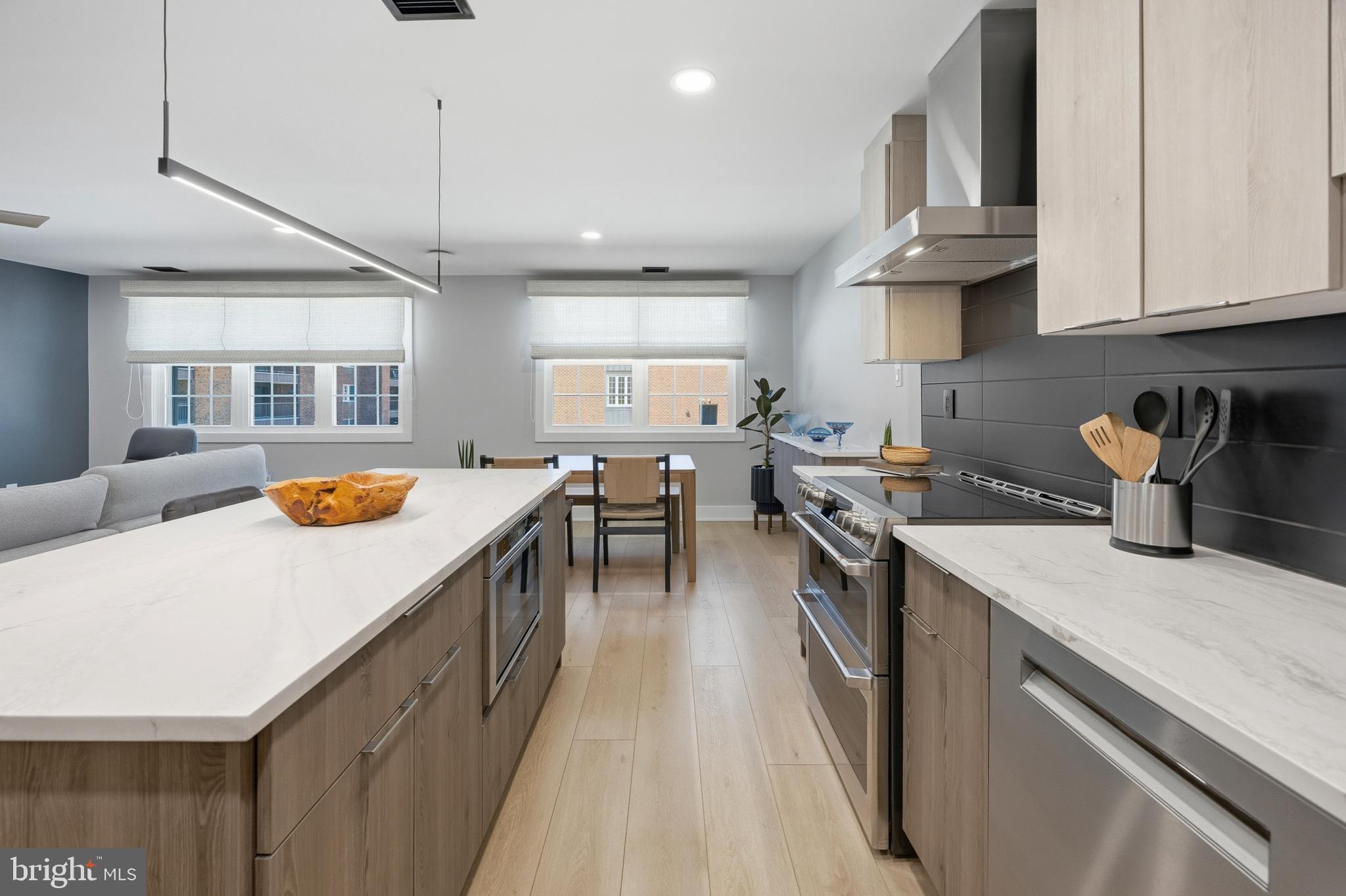 15 Haddonfield Cmns, Unit 15 Haddonfield, NJ 08033 - Photo 5 of 48 a kitchen with stainless steel appliances granite countertop a sink a stove and a refrigerator