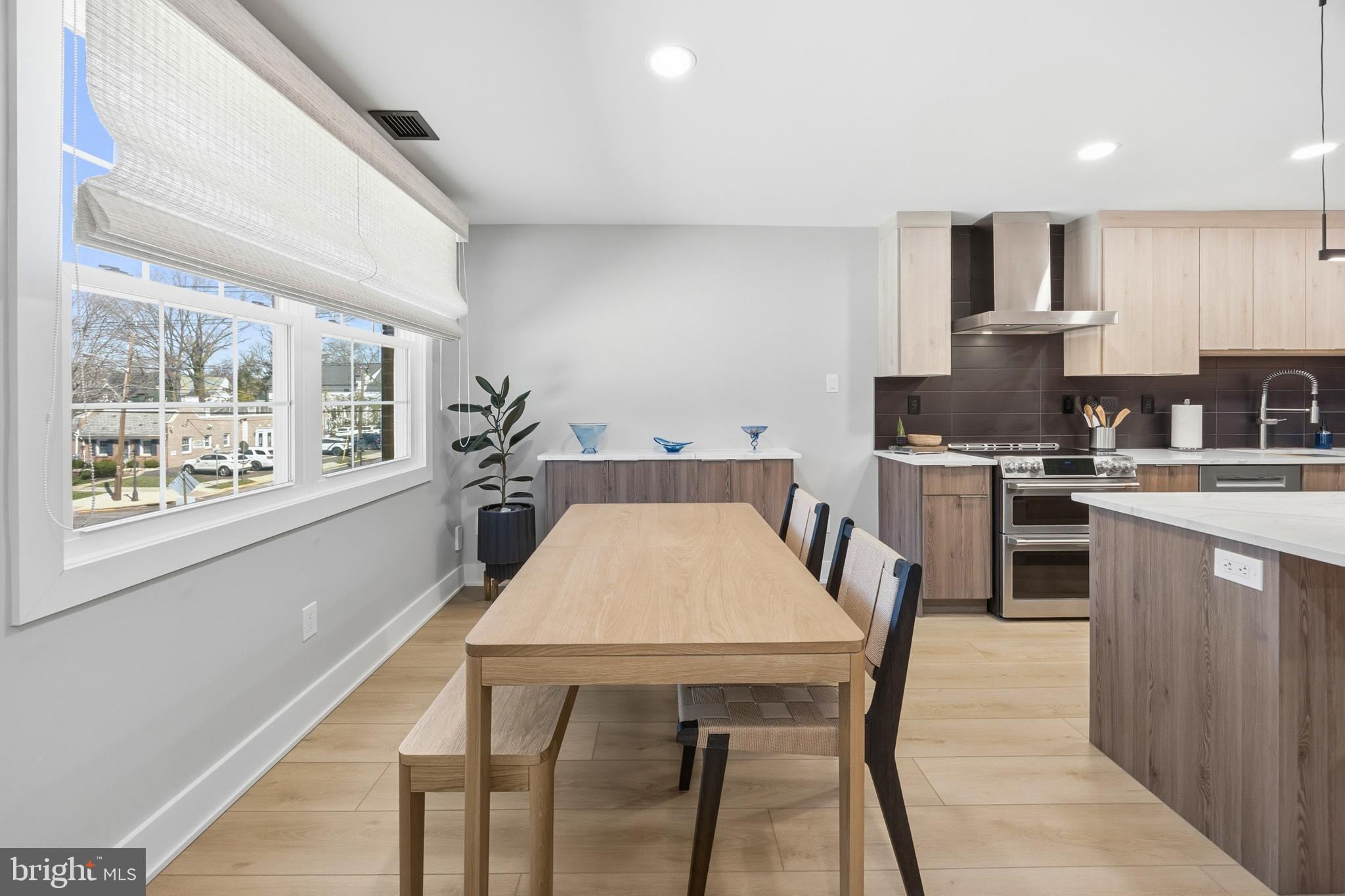 15 Haddonfield Cmns, Unit 15 Haddonfield, NJ 08033 - Photo 6 of 48 a kitchen with a table and chairs in it
