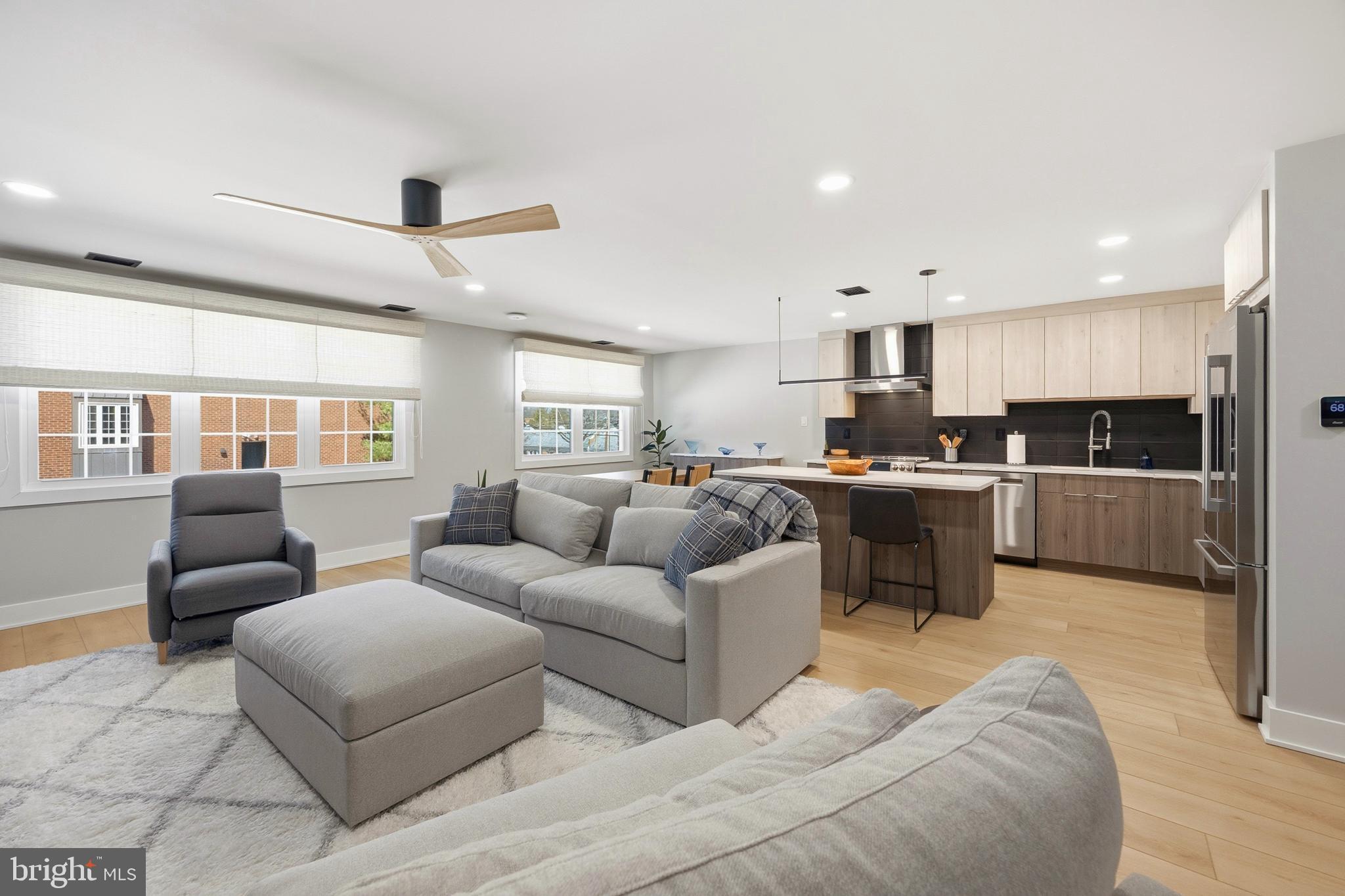 15 Haddonfield Cmns, Unit 15 Haddonfield, NJ 08033 - Photo 9 of 48 a living room with furniture and kitchen view
