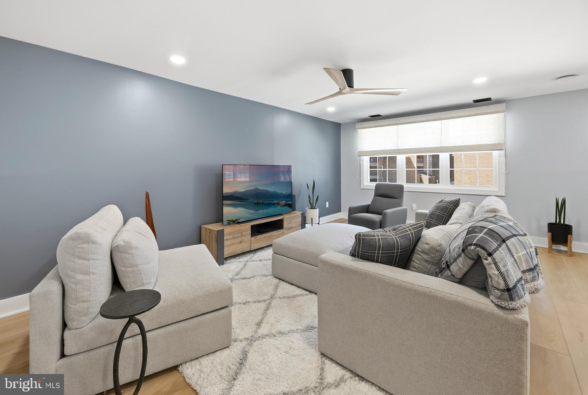 15 Haddonfield Cmns, Unit 15 Haddonfield, NJ 08033 - Photo 10 of 48 a living room with furniture and a flat screen tv