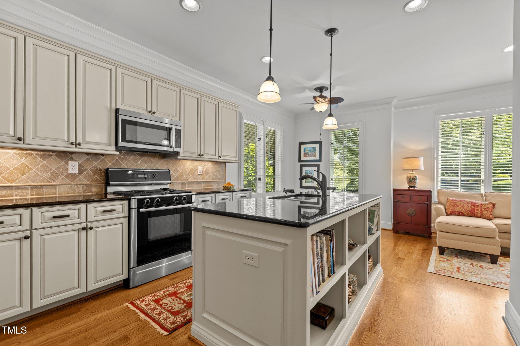 145 Cofield Circle Durham, NC 27707 - Photo 17 of 53 a kitchen with stainless steel appliances granite countertop a stove and a sink